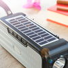 Trådløs højttaler med solopladning og LED-lommelygte Sunker InnovaGoods
